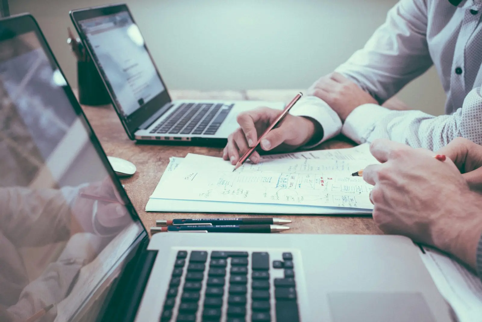 People reviewing documents related to M&A disputes